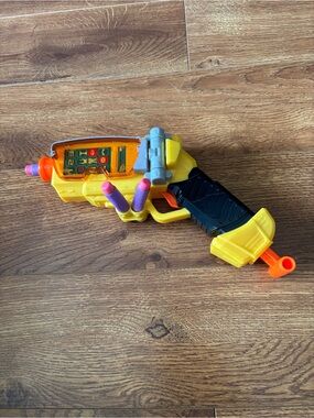 Yellow and Purple Foam Dart Blaster Toy with Black Grip